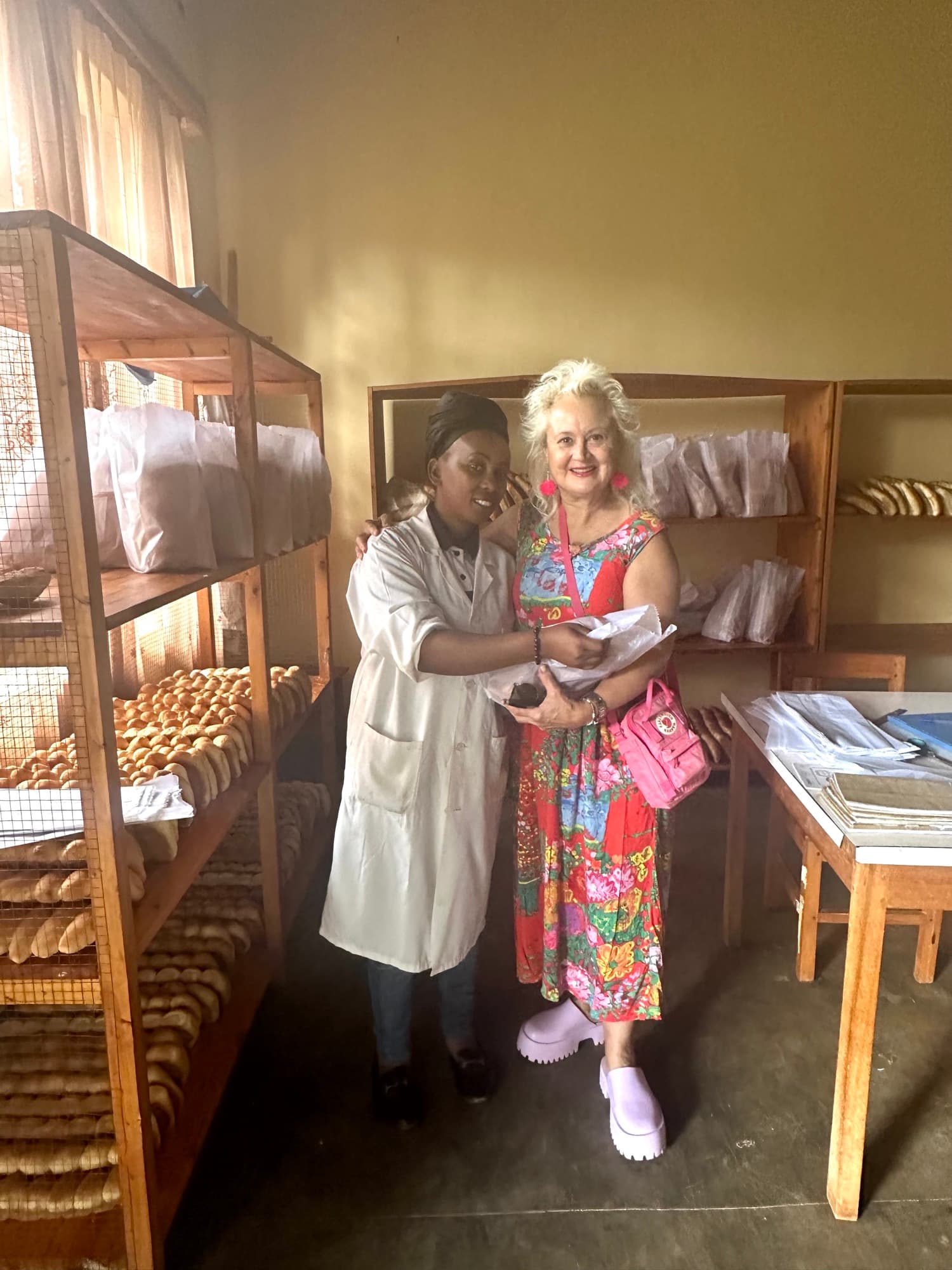 Carolina with bakery artisan in Rwanda